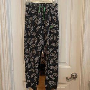 Nike Black and White Logo Joggers with Green Accent